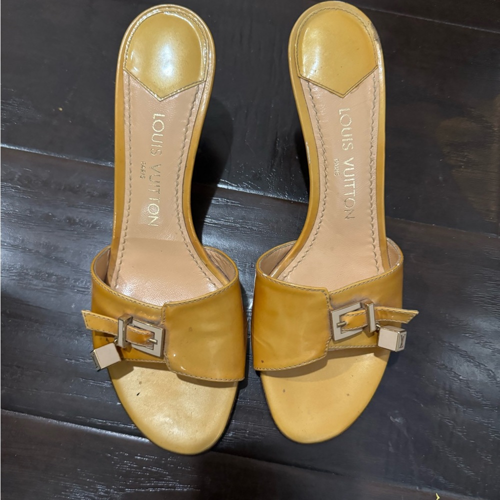 Louis Vuitton gold kitten heels.